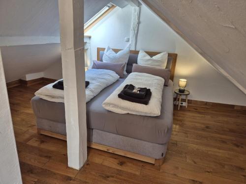 a bedroom with two beds with towels on them at Dachkoje Monschau in Monschau
