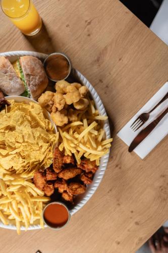 a bowl of food with nachos and chips on a table at Munich Marriott Hotel in Munich