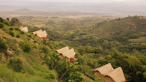 a group of huts on top of a hill at Casa Malva Villas in Buenavista