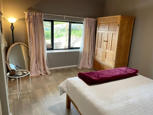 Un ou plusieurs lits dans un hébergement de l'établissement Rosie's Cottage Bindoon