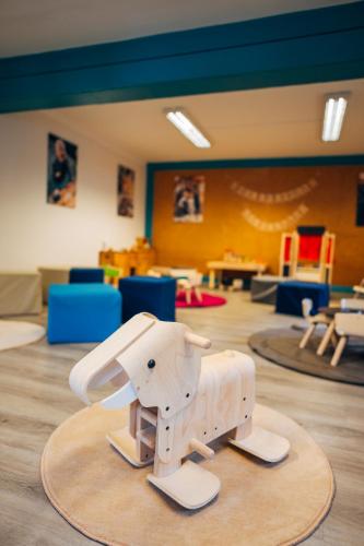 a toy elephant on a table in a room at Slow Travel Resort Kirchleitn in Bad Kleinkirchheim