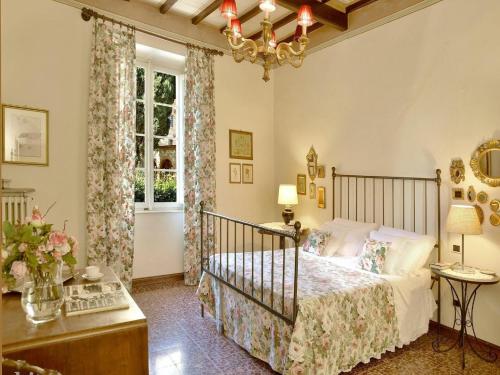 a bedroom with a bed and a window at Spacious Mansion, Casciana in Lari