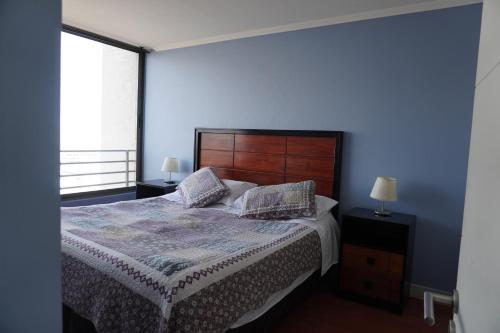 Giường trong phòng chung tại San Pedro Apart