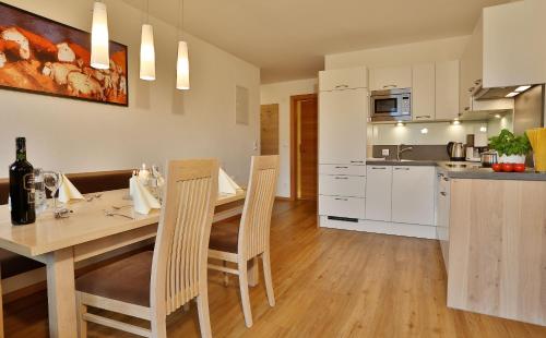 a kitchen and dining room with a table and chairs at Haus Christina in Serfaus