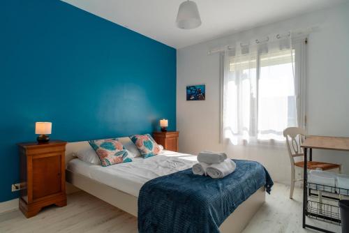 Posteľ alebo postele v izbe v ubytovaní L'escapade - Maison familiale avec jardin Vannes