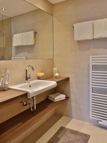 a bathroom with a sink and a mirror at Haus Christina in Serfaus