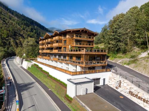 a large building on the side of a road at Das Förstereck in Viehhofen