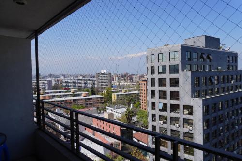 a view of a city from a balcony at Pontoni Providencia in Santiago