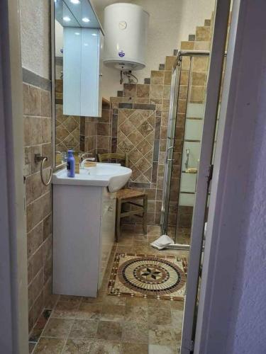 a bathroom with a sink and a shower at Villa Mamia Pool Costa Paradiso in Costa Paradiso