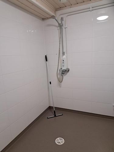 a room with a shower and a pole in it at Ainola in Hämeenlinna