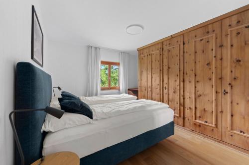 a bedroom with two beds and a window at San Gian C5 in Surlej