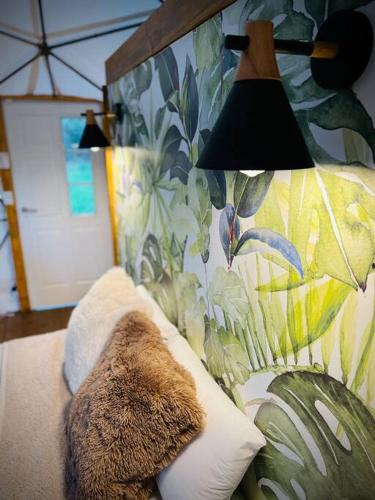 a stuffed animal sitting on a couch with a lamp at Magia Glamping, Domo Full Moon, entre las sierras y el mar in Punta Colorada
