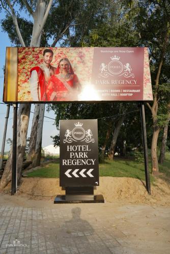 a billboard with a sign for a hotel party reception at Park Regency Kapurthala in Kapūrthala