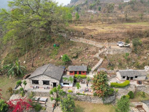 an aerial view of a house on a hill at River Edge Resort Nepal in Benighāt
