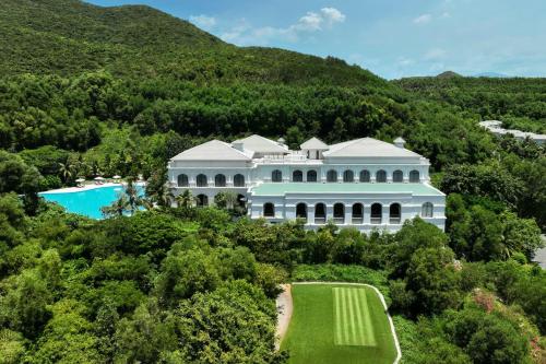 an aerial view of a large white mansion with a pool at Nha Trang Marriott Resort & Spa, Hon Tre Island in Nha Trang