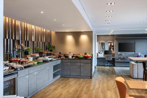 a kitchen with a counter with food on it at Medellin Marriott Hotel in Medellín