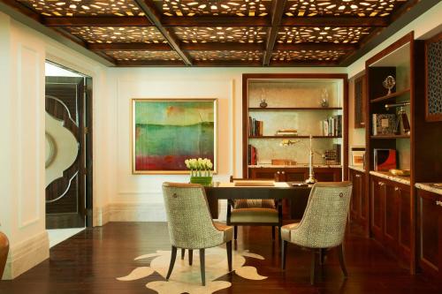 a dining room with a table and chairs at The St. Regis Abu Dhabi in Abu Dhabi