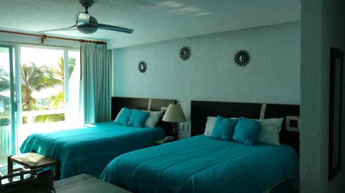 Apartment Ocean Front Cancun 객실 침대