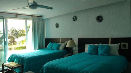 Postel nebo postele na pokoji v ubytování Apartment Ocean Front Cancun