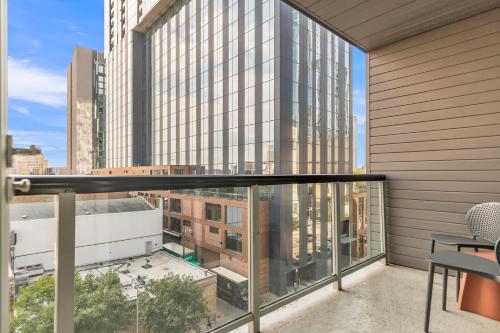 a balcony with a view of a building at Littlefield Lofts, Hosted by Placemakr - 6th St in Austin
