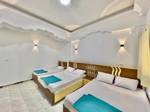 Postel nebo postele na pokoji v ubytování Home Hotel Dahab