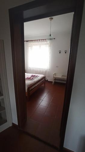 a room with a window with a bed in it at Al Grillo in Carrù