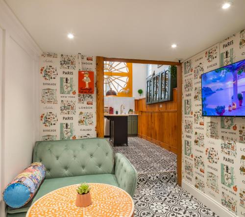 a living room with a couch and a table at Modern Marvel at University City in Philadelphia