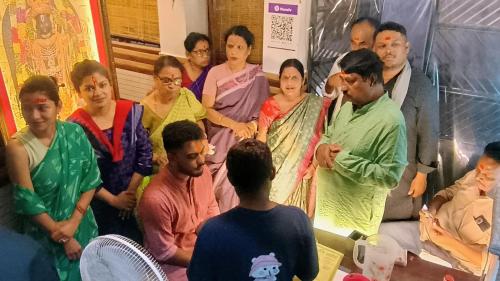 a group of people standing in a room at vaidehi homlee premium stay, 3kms from Shri Ram janmbhoomi, Ayodhya in Faizābād