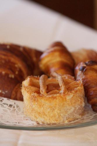 a plate of pastries sitting on a table at Altavilla Locanda E Tipica Trattoria in Bianzone