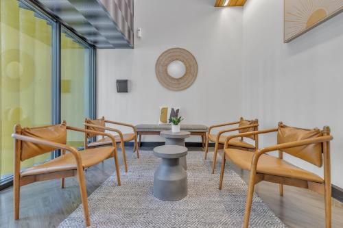 a row of chairs in a waiting room at Littlefield Lofts, Hosted by Placemakr - 6th St in Austin