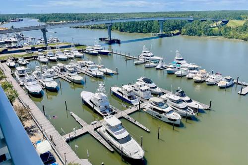 an aerial view of a marina with boats in the water at The Wharf 406 in Orange Beach