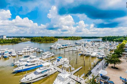 a bunch of boats docked at a marina at The Wharf 406 in Orange Beach