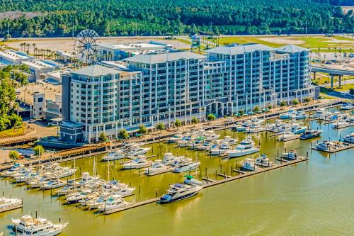 an aerial view of a marina with boats in the water at The Wharf 406 in Orange Beach