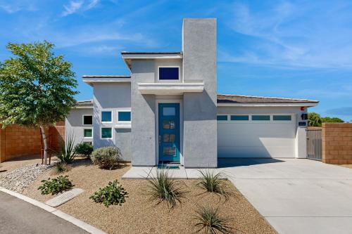 a house with a driveway in front of it at Rio Del Sol Retreat in Cathedral City
