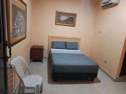 Postel nebo postele na pokoji v ubytování Hotel Caribe