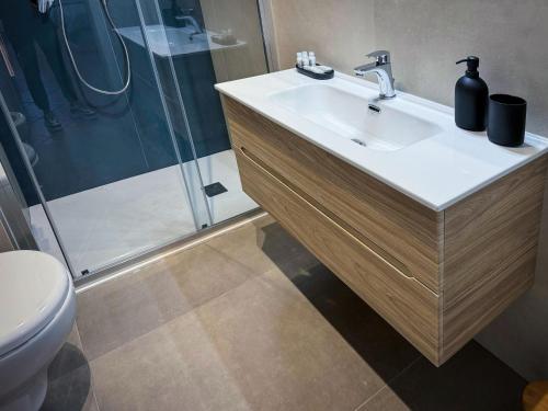 a bathroom with a sink and a shower at Residenza Gonzaga in Mantova