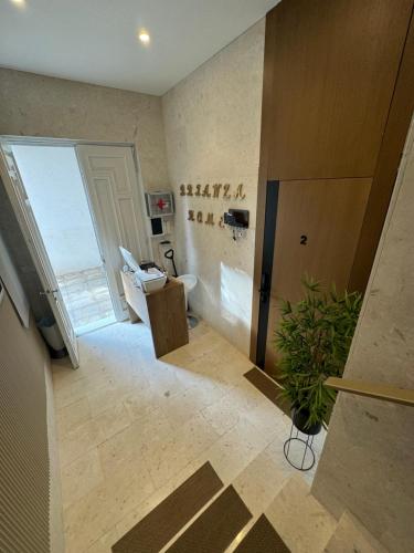 a bathroom with a sink and a toilet in a room at Brianza Home in Giussano