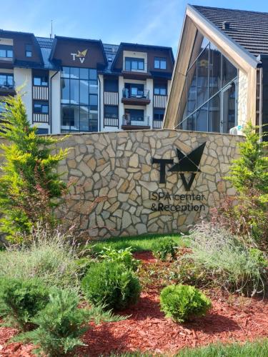 a sign in front of a building at Titova Vila Apartman Jelka in Palisad