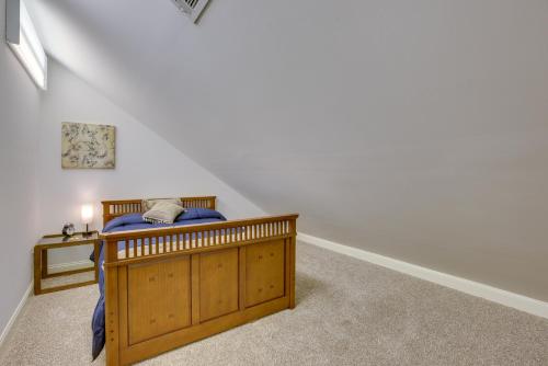 a bedroom with a wooden bed in a room at Fish, Swim and More Lakefront Alabaster Home in Alabaster