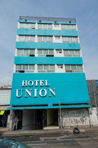 a hotel union sign in front of a building at Hotel Union Guadalajara in Guadalajara