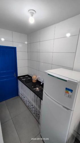 Η κουζίνα ή μικρή κουζίνα στο Casa temporada aconchegante