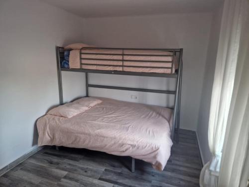 a bedroom with two bunk beds in a room at Villas de encanto in Vilamarxant