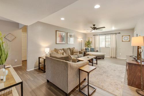 a living room with a couch and a table at Heated pool, Sports Court, Pool table, King beds in Tempe Junction