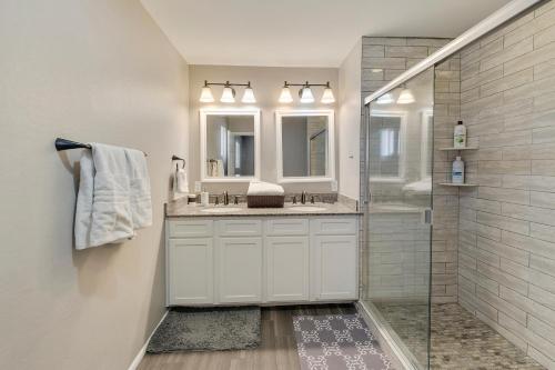 a white bathroom with a shower and a sink at Heated pool, Sports Court, Pool table, King beds in Tempe Junction