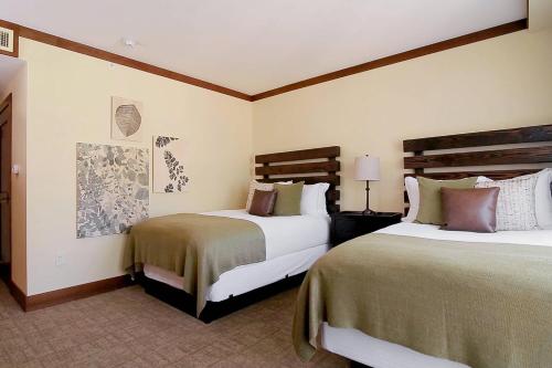 a hotel room with two beds in a room at The Ritz-Carlton, Lake Tahoe in Truckee