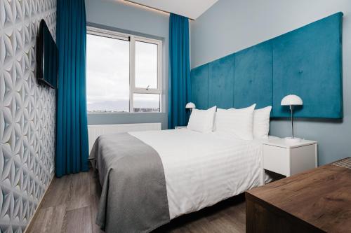 Katil atau katil-katil dalam bilik di ODDSSON Midtown Hotel