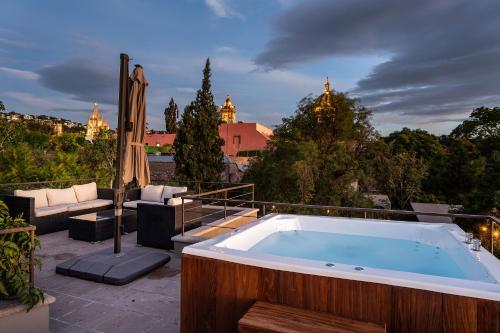 a bath tub sitting on top of a patio at Casa Quebrada, New 3BR Modern Home in Centro in San Miguel de Allende