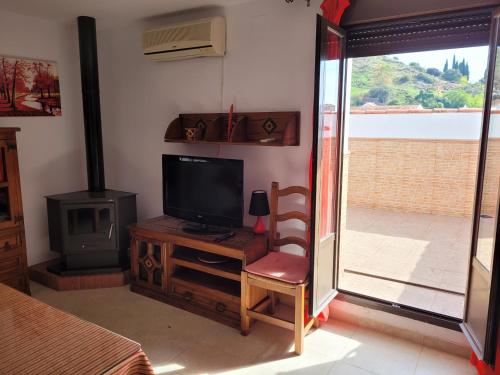 Μια τηλεόραση ή/και κέντρο ψυχαγωγίας στο Apartamento La alberca 1