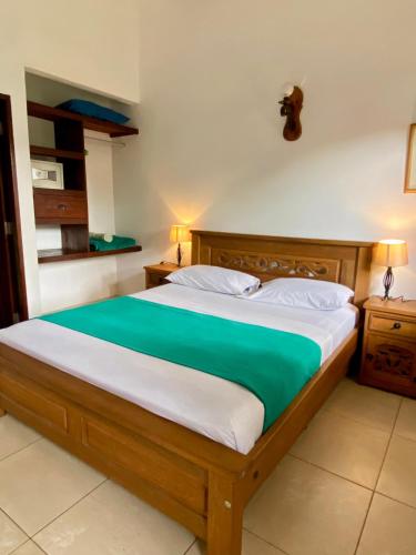 Ένα ή περισσότερα κρεβάτια σε δωμάτιο στο Camali Hotel