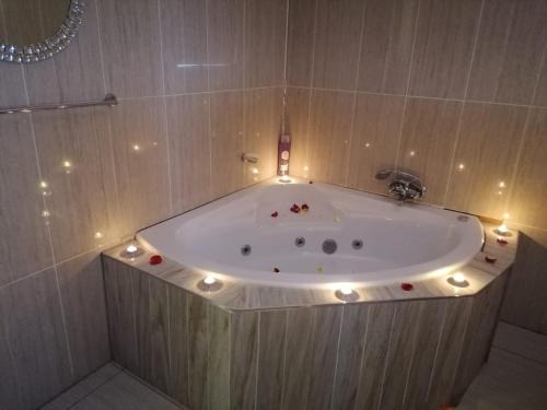 a bath tub with lights around it in a bathroom at Ein Gedi Premier Weddings And Conferences in Kimberley